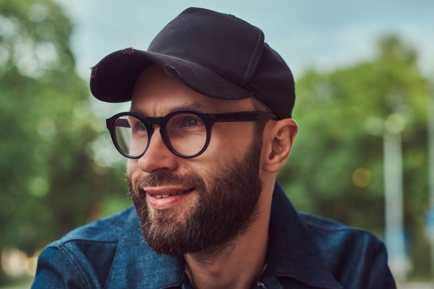 portrait-of-a-bearded-hipster-in-glasses-and-cap-o-2023-11-27-04-54-06-utc (1)